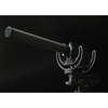 This is a photo of the Sanken CS-2 microphone in black. It is a side view and the microphone is shown at an angle held up by a piece of black equipment. Shown on black background.
